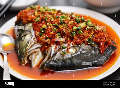  Spicy Steamed Fish with Pickled Peppers: Can This Fiery Huanggang Dish Tantalize Your Taste Buds While Quenching Your Spice Cravings?